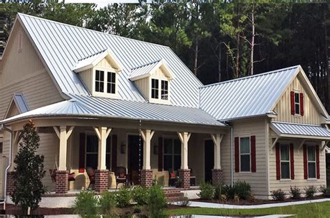 beige house with metal roof|beige exterior home.